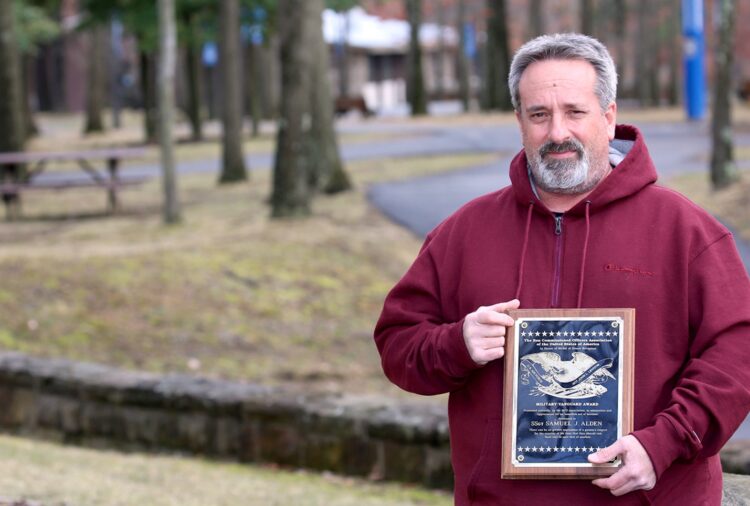 Air Force veteran Samuel Alden, 60, of New Castle, holds a commendation he received for saving the life of an Army paratrooper who was tangled outside a Lockheed C-130 Hercules aircraft 2,000 feet over Alaska in 1990. Alden, shown March 1 on BC3’s main campus in Butler Township, earned an associate degree in history from BC3 @ Lawrence Crossing in New Castle in 2020. BC3 has been designated as a Military Friendly School for the sixth time since 2013 by Viqtory.