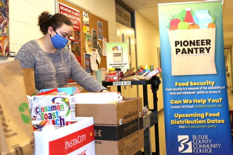 Butler County Community College student Maissa Ishler, 19, of Butler, prepares donated food for distribution at the BC3 Pioneer Pantry on Feb. 4, 2021. Ishler, a BC3 business administration student, manages semimonthly distributions as a BC3 work-study student. BC3’s initiative to confront food insecurity marks its second anniversary this month.