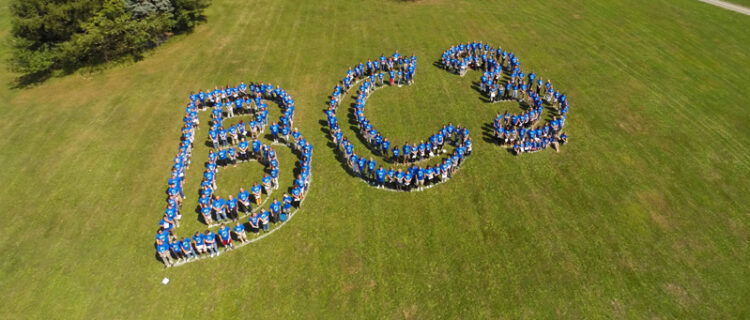 Drone view of employees spelling out BC3