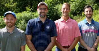 This is a portrait of the Nonprofit Development Corp. team at BC3 Education Foundation golf outing. There are four golfers in the photo. 