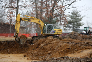 excavator removes soil