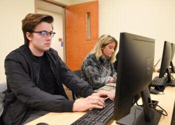 Students studying at a computer.