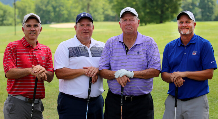 four men on golf course
