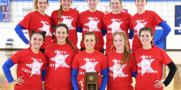 volleyball team hold trophy in gym