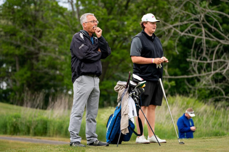 Butler County Community College golf coach Bill Miller and sophomore Pioneers golfer Liam Kosior are shown Thursday, June 8, 2023, during the third round of the National Junior College Athletic Association Division III national championship tournament in Chautauqua, N.Y. Kosior, a Neshannock High School graduate, is tied for 20th place among the 98 golfers competing for All-American status on the par-72 Chautauqua Golf Club Lake Course.