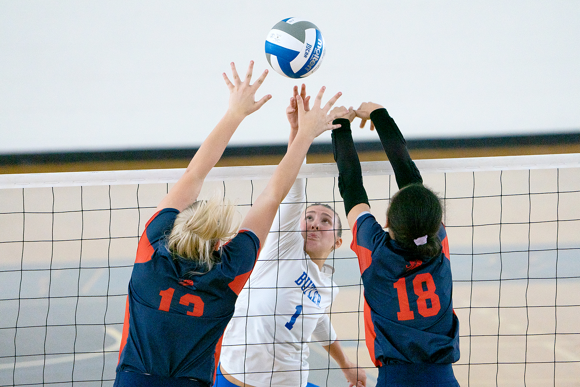 Jozee Weaver, center, a freshman middle hitter on the Butler County Community College volleyball team, reaches for a shot against Greenleigh Gleason, left, and Leah Pimentel, of Caldwell Community College and Technical Institute, during the National Junior College Athletic Association Division III Mid-Atlantic District final Saturday, Oct. 28, 2023, in BC3’s Field House. Caldwell Community College and Technical Institute, Hudson, N.C., defeated the Pioneers in five sets.